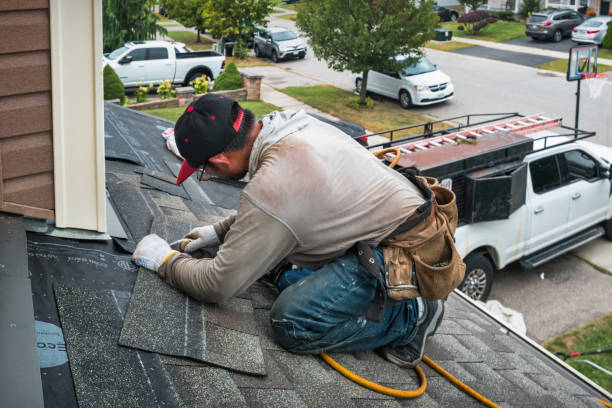 Professional Roofing technician working in Elmwood, MA